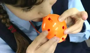 Ocarina Playing Young girl playing the 4-hole Oc® Ocarina