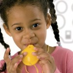 Young girl playing the Ocarina